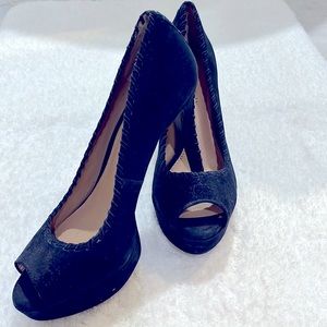Gently used, navy blue Antonio Melani high heel shoes.